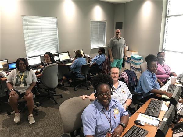 office staff pose for photo
